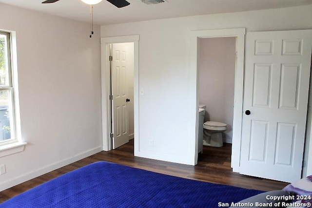 bedroom with dark hardwood / wood-style flooring, multiple windows, and ceiling fan