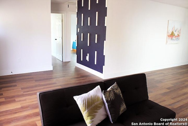 unfurnished living room featuring hardwood / wood-style flooring