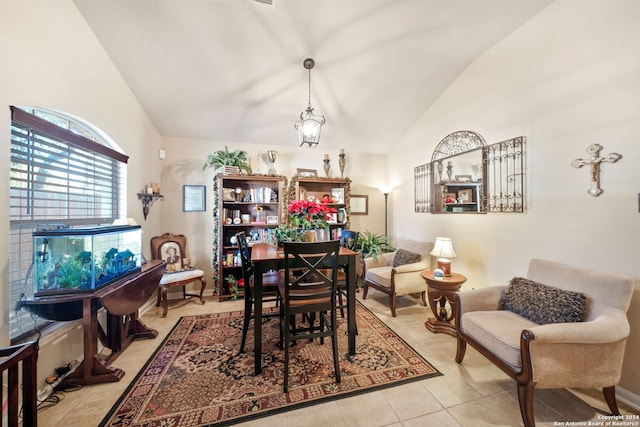 tiled dining area with lofted ceiling