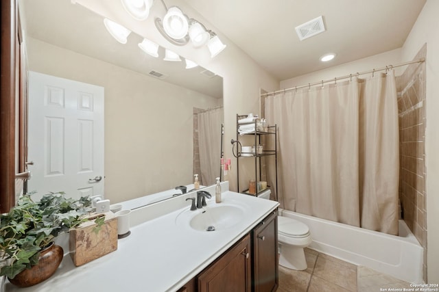 full bathroom featuring toilet, shower / bath combination with curtain, vanity, and tile patterned floors