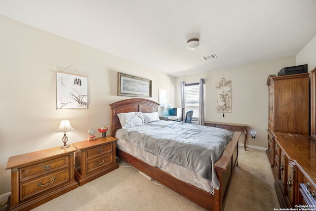 bedroom with light colored carpet