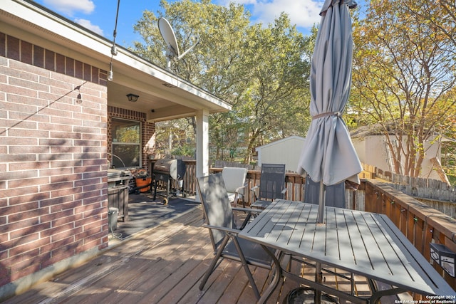 wooden deck with grilling area