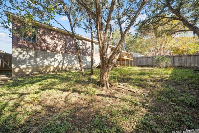 view of yard with a wooden deck