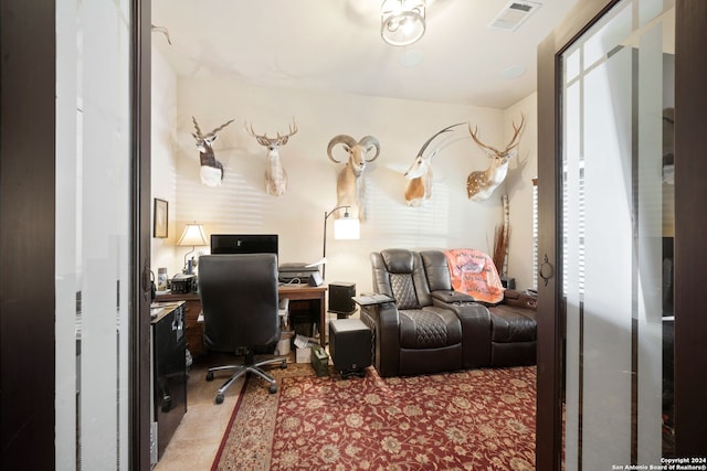 office area featuring light carpet