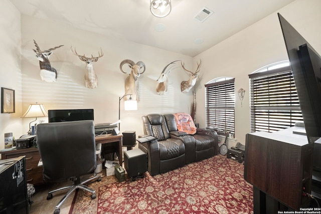 office area with vaulted ceiling