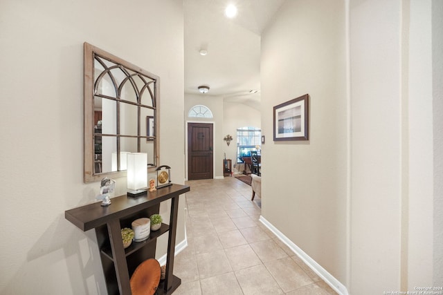 hall featuring light tile patterned floors