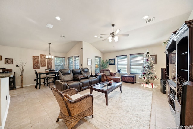 tiled living room featuring ceiling fan with notable chandelier and lofted ceiling