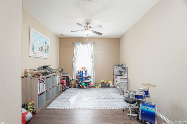 rec room with ceiling fan and hardwood / wood-style floors