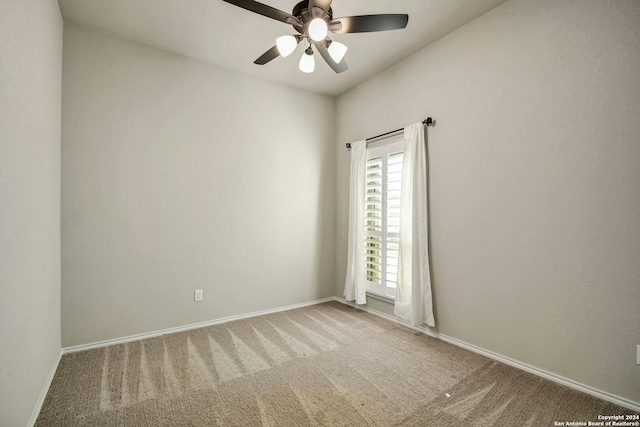 unfurnished room featuring ceiling fan and carpet floors