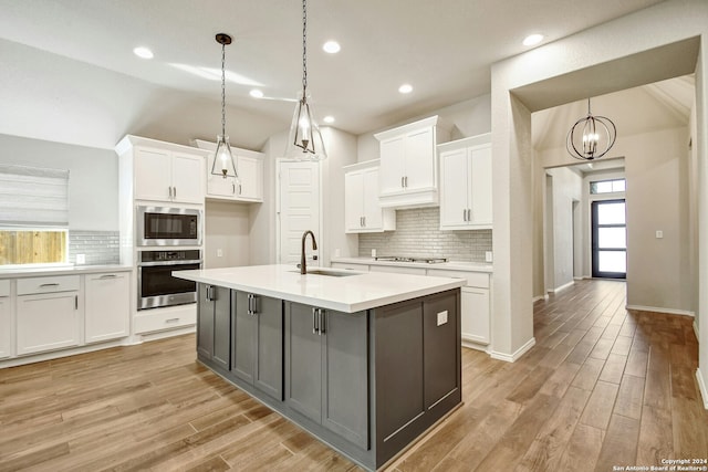 kitchen with white cabinetry, sink, and appliances with stainless steel finishes