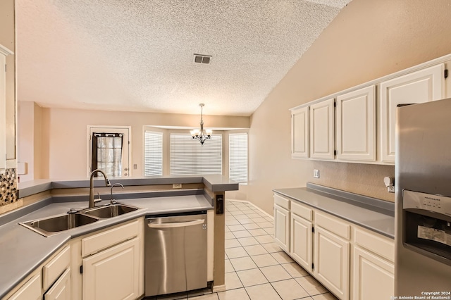 kitchen featuring white cabinetry, sink, stainless steel appliances, a chandelier, and decorative light fixtures