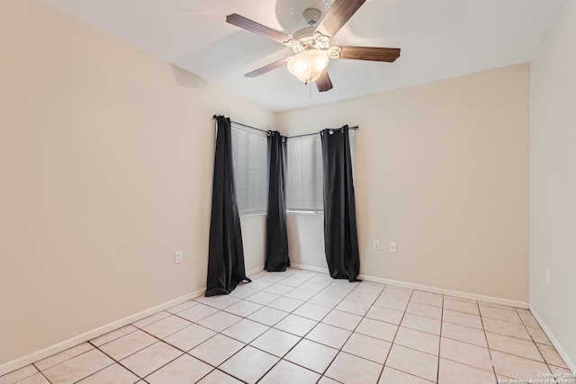 tiled empty room with ceiling fan