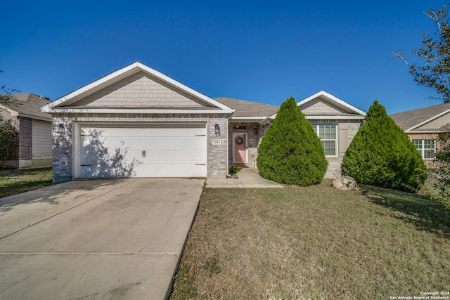 ranch-style home with a front yard and a garage