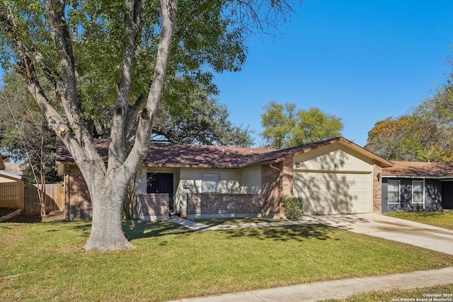 ranch-style house with a garage and a front lawn