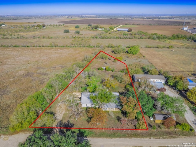 birds eye view of property with a rural view