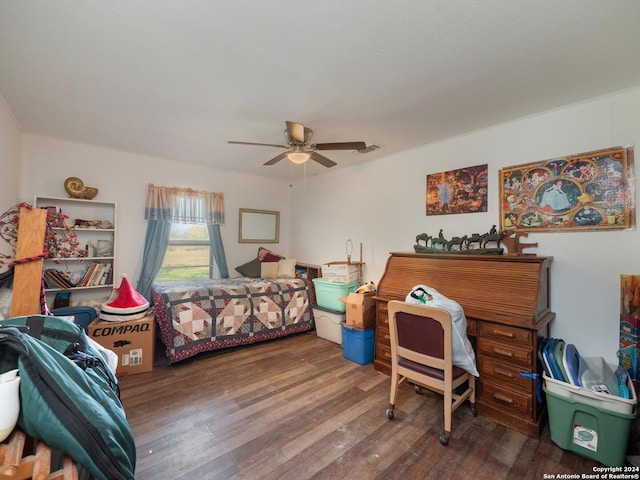 bedroom with ceiling fan and hardwood / wood-style flooring