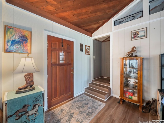 entrance foyer featuring wooden ceiling, wood walls, dark hardwood / wood-style floors, and vaulted ceiling