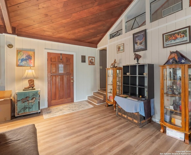 entryway featuring wood ceiling, lofted ceiling, and hardwood / wood-style flooring