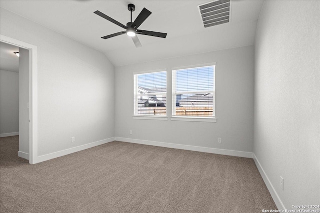 empty room with carpet flooring, ceiling fan, and lofted ceiling