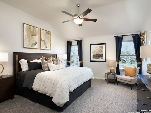 carpeted bedroom with vaulted ceiling and ceiling fan