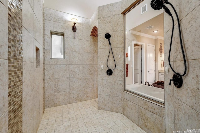 bathroom featuring a tile shower and ornamental molding