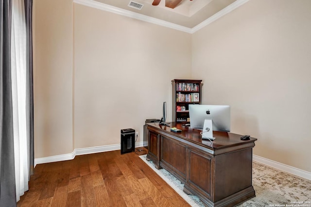 office area with hardwood / wood-style floors and ornamental molding