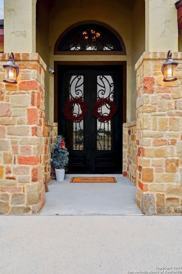 entrance to property featuring french doors