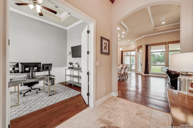 office featuring light hardwood / wood-style flooring and crown molding