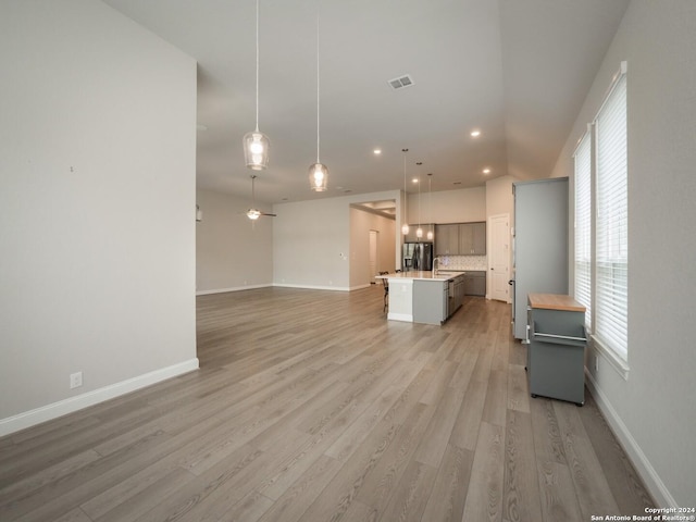 living room featuring sink and light wood-type flooring