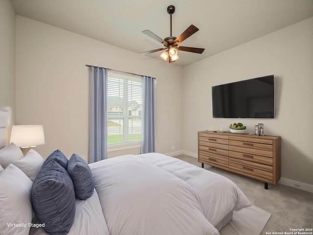 carpeted bedroom featuring ceiling fan