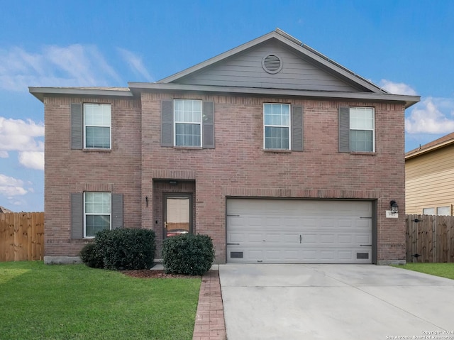 view of front facade with a front lawn and a garage