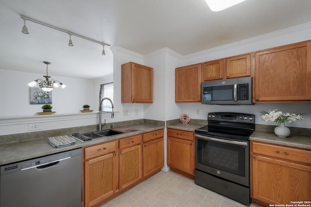 kitchen featuring sink, rail lighting, stainless steel appliances, an inviting chandelier, and crown molding