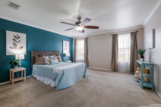 bedroom featuring multiple windows, ceiling fan, and light carpet