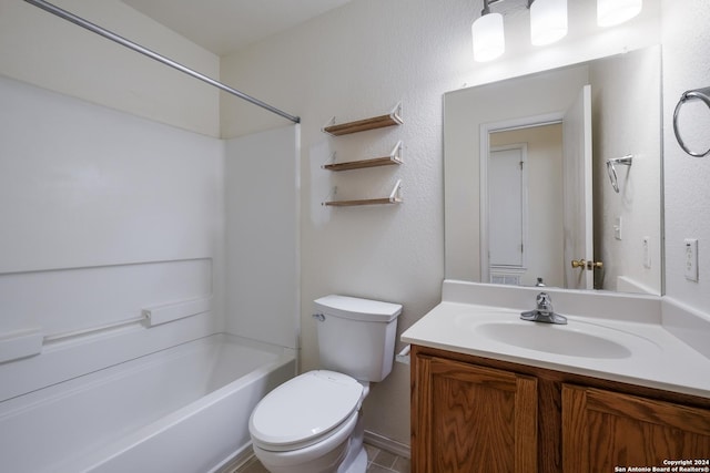 full bathroom with shower / bathing tub combination, tile patterned flooring, vanity, and toilet