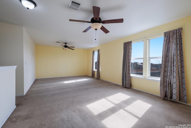 empty room with light carpet and ceiling fan