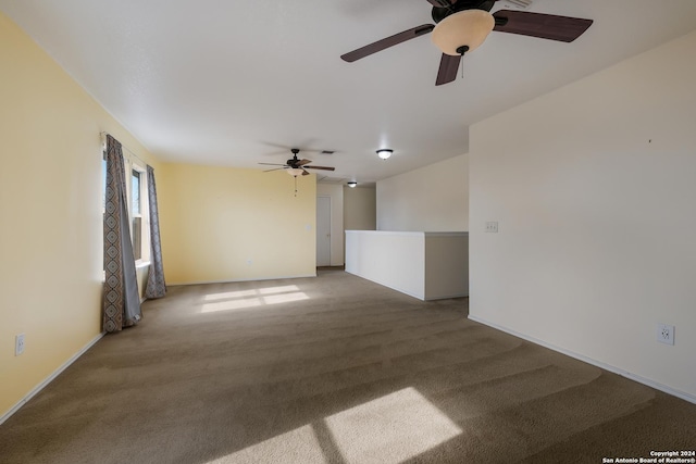 spare room with carpet flooring and ceiling fan