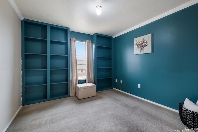 unfurnished bedroom featuring crown molding, carpet, and a textured ceiling