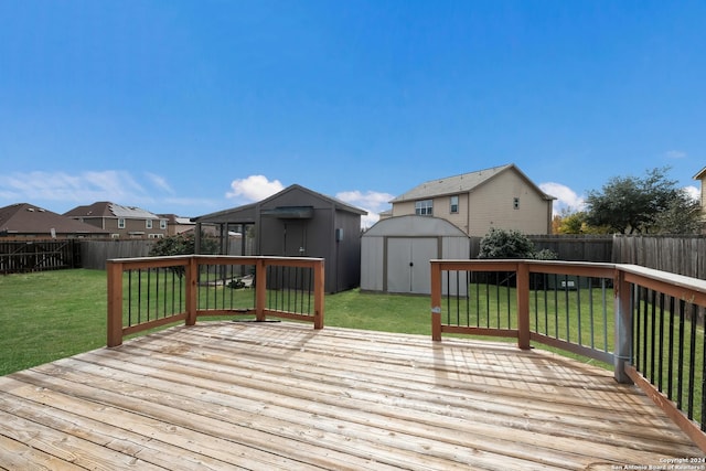 deck with a shed and a yard