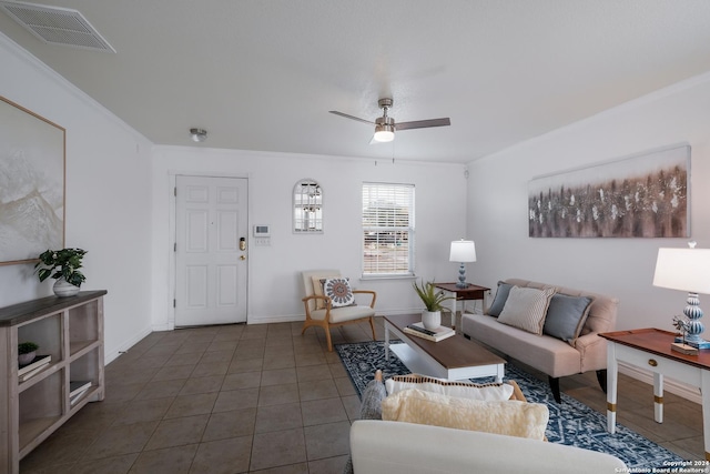 tiled living room featuring ceiling fan