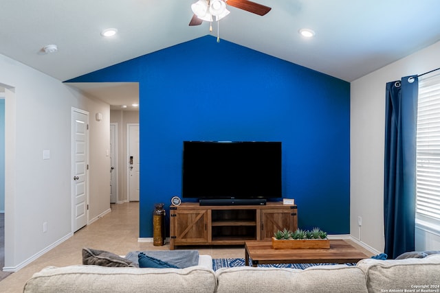 living room with ceiling fan and lofted ceiling