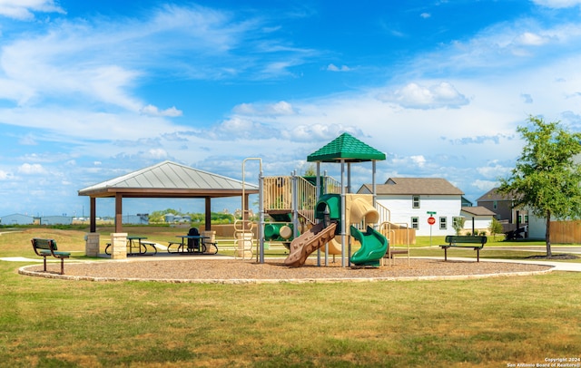 view of jungle gym with a gazebo and a lawn