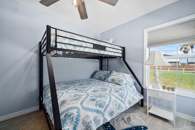 bedroom with ceiling fan and light hardwood / wood-style floors