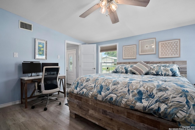 bedroom featuring hardwood / wood-style flooring, ceiling fan, and vaulted ceiling