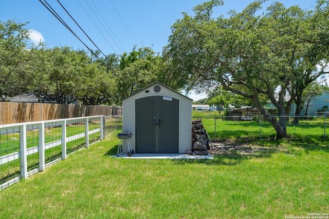 view of outbuilding featuring a lawn