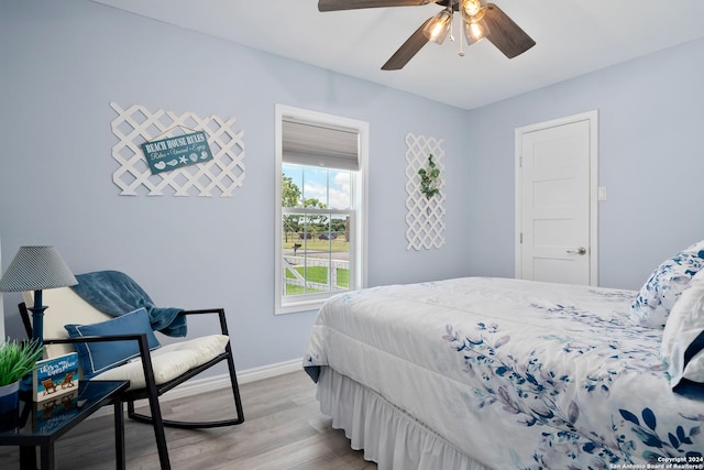 bedroom featuring ceiling fan and light hardwood / wood-style floors