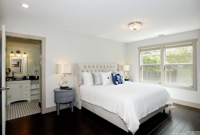 bedroom featuring dark hardwood / wood-style floors and sink