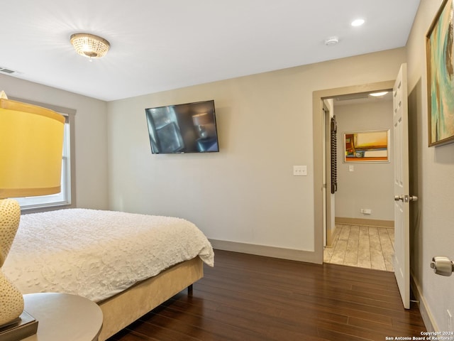 bedroom featuring dark hardwood / wood-style floors