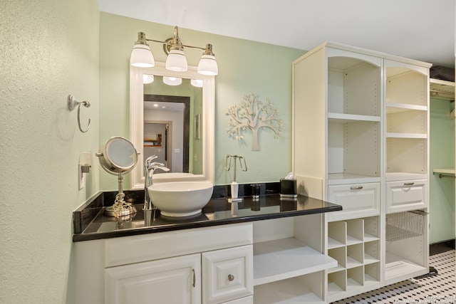 bathroom with tile patterned floors and vanity