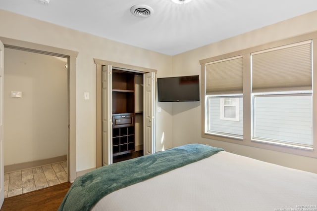 bedroom featuring dark hardwood / wood-style flooring