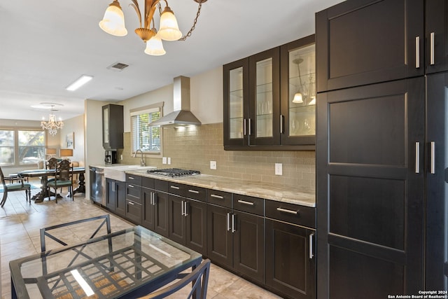 333 Redwood St, Alamo Heights, TX 78209 - kitchen featuring island exhaust hood, a chandelier, stainless steel appliances, tasteful backsplash, and glass insert cabinets